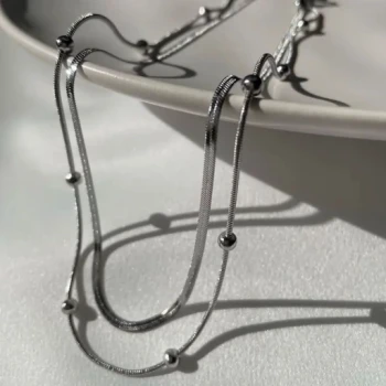 گردنبند دولاین زنجیر توپی و ماری استیل در دورنگ طلایی و نقره ای رنگ ثابت