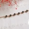 دستبند زنانه استیل طلایی با نگین باگت سبز رنگ گد 1371